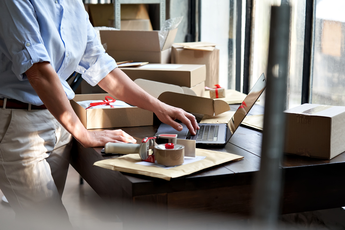Female Online Business Owner Packing Shipping